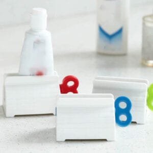 Rolling Tube Toothpaste Squeezers Dispenser Seat Holder Stand Bathroom Product (random color)